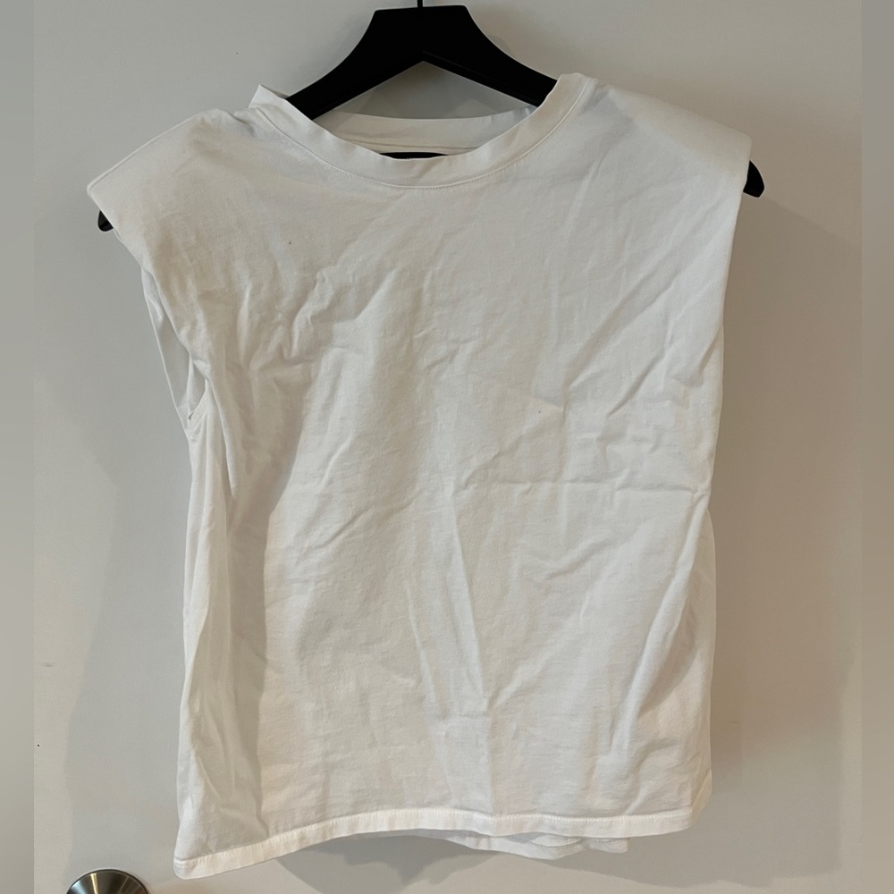 Sleeveless top with shoulder pads